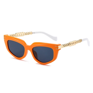 Retro cat eye sunglasses with vibrant orange frame and gold metal chain temples