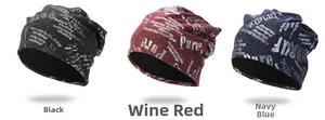 Flat lay of knit beanies in black, wine red, and navy blue with white letter patterns