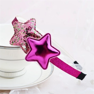 Detailed view of a pink glitter headband featuring metallic and sparkling star ornaments