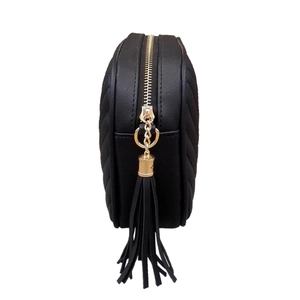 Fashionable black quilted crossbody bag with gold zipper and stylish long tassel charm