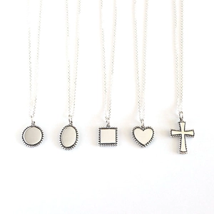 Minimalist S925 sterling silver necklaces with assorted geometric pendants set on white