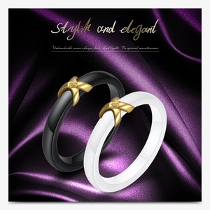 Close-up of black and white ceramic X-rings with gold metal and zircon on silk