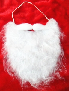 Detail of white plush Santa Claus beard with elastic strap on red velvet background