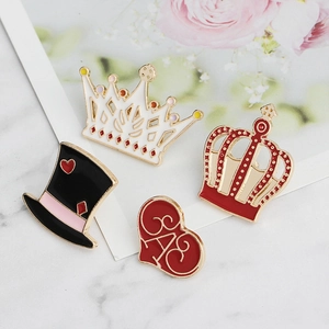 Enamel crown and heart brooch set featuring black top hat on marble and floral background