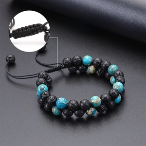 Detail of double-layer volcanic stone and turquoise woven bracelet with adjustable cord