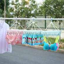 Outdoor view of multi-functional plastic drying racks with clips for socks and underwear