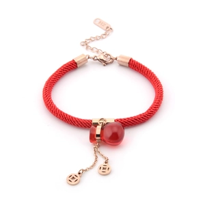 Red braided rope bracelet with rose gold hollow coin charms and a red gourd pendant