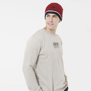 Detail of color-block knit beanie featuring red, white, and black with Cool Cheer text