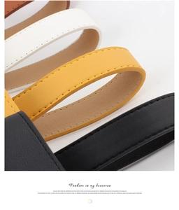 Macro d'une ceinture en cuir de qualité avec coutures précises en plusieurs coloris
