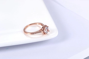 Macro shot of 18K GP rose gold halo ring with sparkling round-cut cubic zirconia crystals