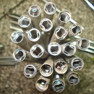 Close-up of telescopic metal tubes with round cross-section for Christmas doll accessories