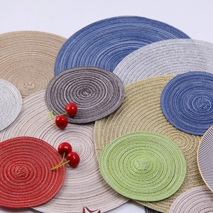 Macro shot of colorful woven placemats with spiral texture in red gold and blue