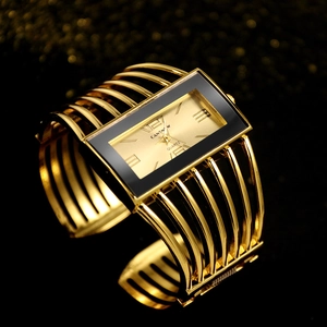 Macro detail of golden镂空cuff quartz watch with rectangular textured dial and roman numerals