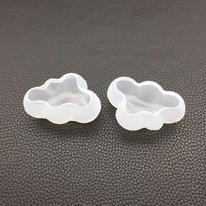 Detailed view of two 3D cloud-shaped silicone molds for DIY resin and candle casting