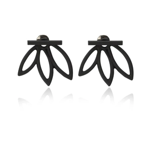 Detailed view of black matte lotus-shaped earrings with minimalist geometric design