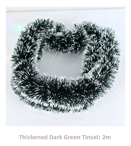Close-up of 2-meter thick dark green Christmas tinsel garland with white tips for decor