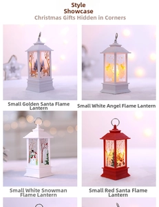 Detail of four Christmas LED lanterns with Santa, Angel and Snowman motifs in warm light