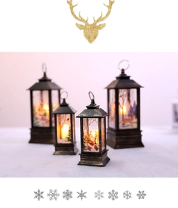 Close-up of vintage bronze Christmas lanterns with warm LED candles and reindeer patterns