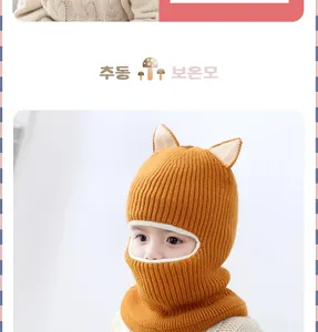 Detail of children's knitted hooded scarf with cat ears and warm fleece lining