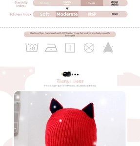 Detail of red knit cat ear hat showing soft ribbed texture and elastic material properties