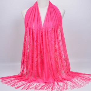 Detailed view of pink floral lace shawl with delicate hollow patterns and fringe trim