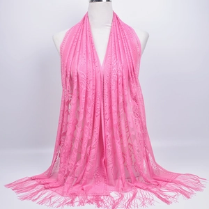 Detailed view of pink floral lace shawl with delicate long fringe tassels for women