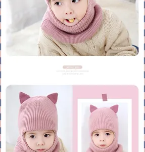 Detail of pink toddler knit hat set with cat ears and matching scarf for winter warmth