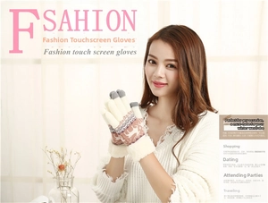 Close-up of winter knit gloves with reindeer pattern and touch screen conductive fingertips