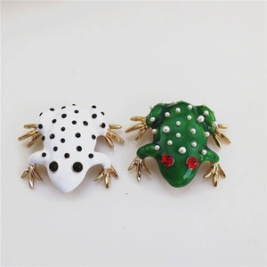 Elegant frog brooches with white enamel dots and green rhinestone pearls in gold finish
