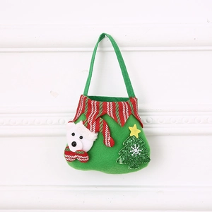 Detail of Christmas green felt gift bag with polar bear and sparkling tree decor