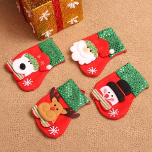 Detail of Christmas stockings with Santa, Snowman, Reindeer and Bear 3D appliques
