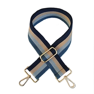 Adjustable striped canvas shoulder strap with gold metal hardware for handbags