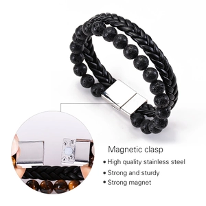 Detail view of double-layer men's bracelet with black leather, lava stone, and magnetic clasp
