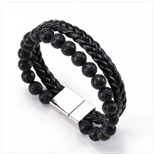 Macro detail of men's double-layer black leather braid and volcanic lava stone beads