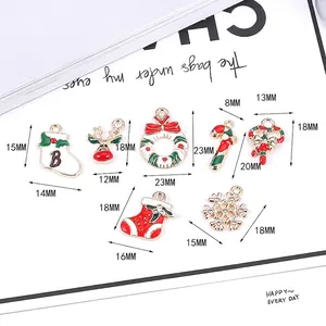 Assorted Christmas alloy charms with dimensions including reindeer and snowflake pendants
