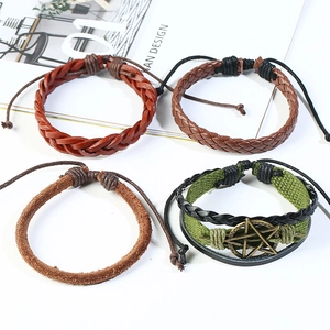 Set of 4 vintage braided leather bracelets for men featuring bronze star charms