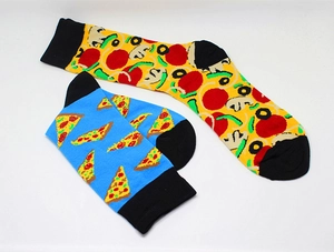 Detail of vibrant blue and yellow cotton socks featuring novelty pizza slice patterns