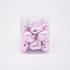 Macro view of light pink heart shaped Christmas ornaments in a clear plastic display box