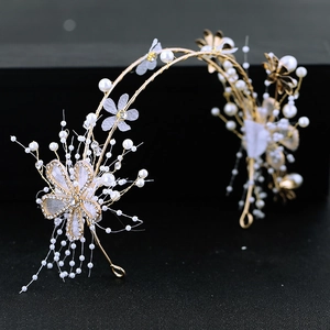 Elegant bridal headband with gold alloy flowers, white pearls and crystal beads on black background
