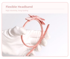 Close-up of flexible pink ribbon headband showing high elasticity and durable bending feature