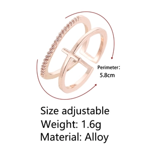 Detail view of adjustable rose gold double-layer ring with cross and zirconia inlay