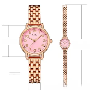 Detail of rose gold quartz watch with pink dial and measurements of 26mm case and 200mm band