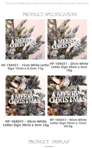 Macro shot of white glitter Merry Christmas signs with reindeer and cedar tree designs