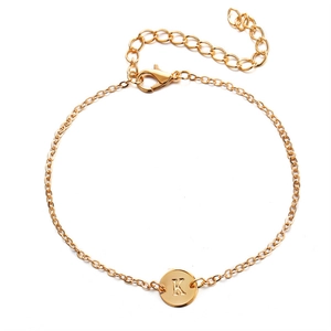 Chic gold-plated chain bracelet featuring a round hollow pendant with the letter K
