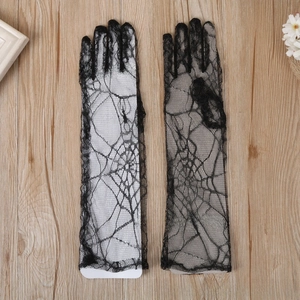 Close-up of black spider web lace long gloves for Halloween cosplay costumes