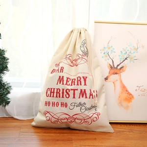 Close-up of large linen Christmas drawstring gift bag with Merry Christmas print
