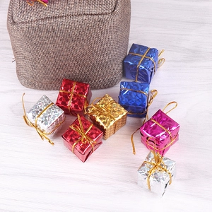 Colorful 2.5cm laser Christmas gift box ornaments for tree decoration on wooden background