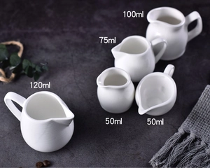 White ceramic milk pitchers with handles in various sizes from 50ml to 120ml