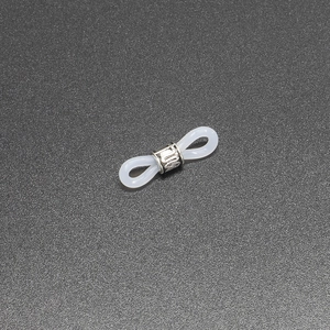 Macro shot of white silicone anti-slip loop with adjustable silver metal coil for glasses