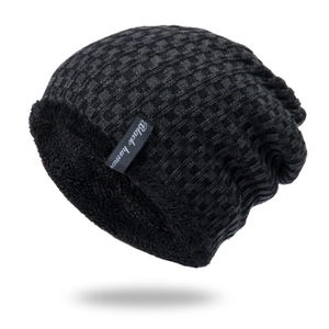 Detailed macro shot of the thick black fleece lining inside the thermal knit beanie
